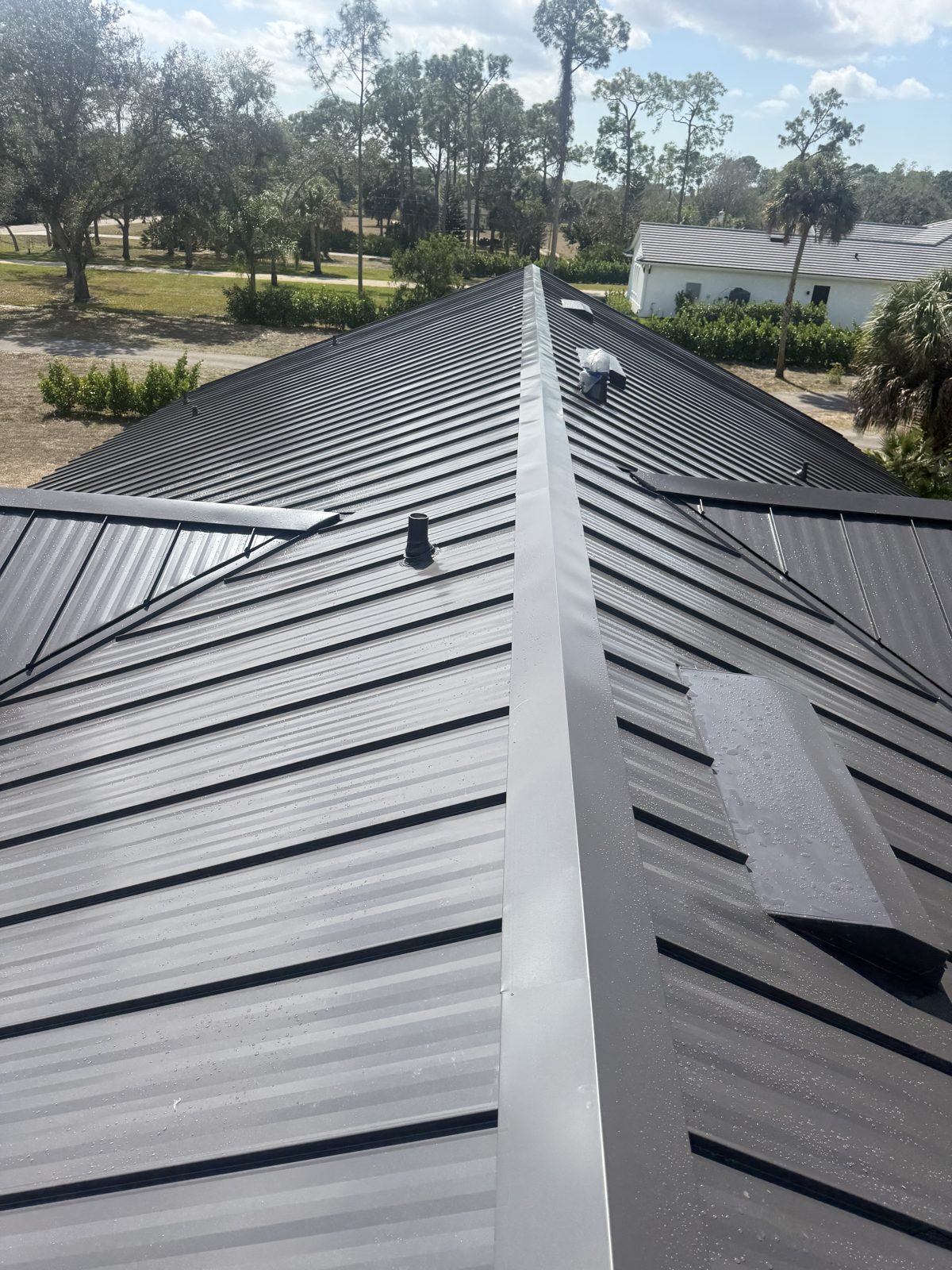Standing-seam metal roof installed by Anchor Construction Group in Southwest Florida